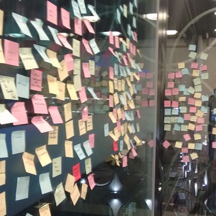 Postit notes on a glass wall